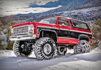 זחלן טרקסס 1/10 דגם TRX-4 הנעה 4X4 דגם בלייזר אדומה/שחורה מוכן לנסיעה