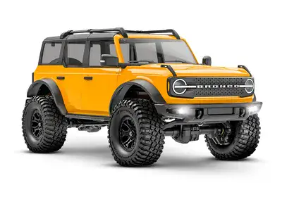 זחלן טרקסס 1/18 דגם פורד ברונקו TRX-4M מוכן לנסיעה בצבע כתום